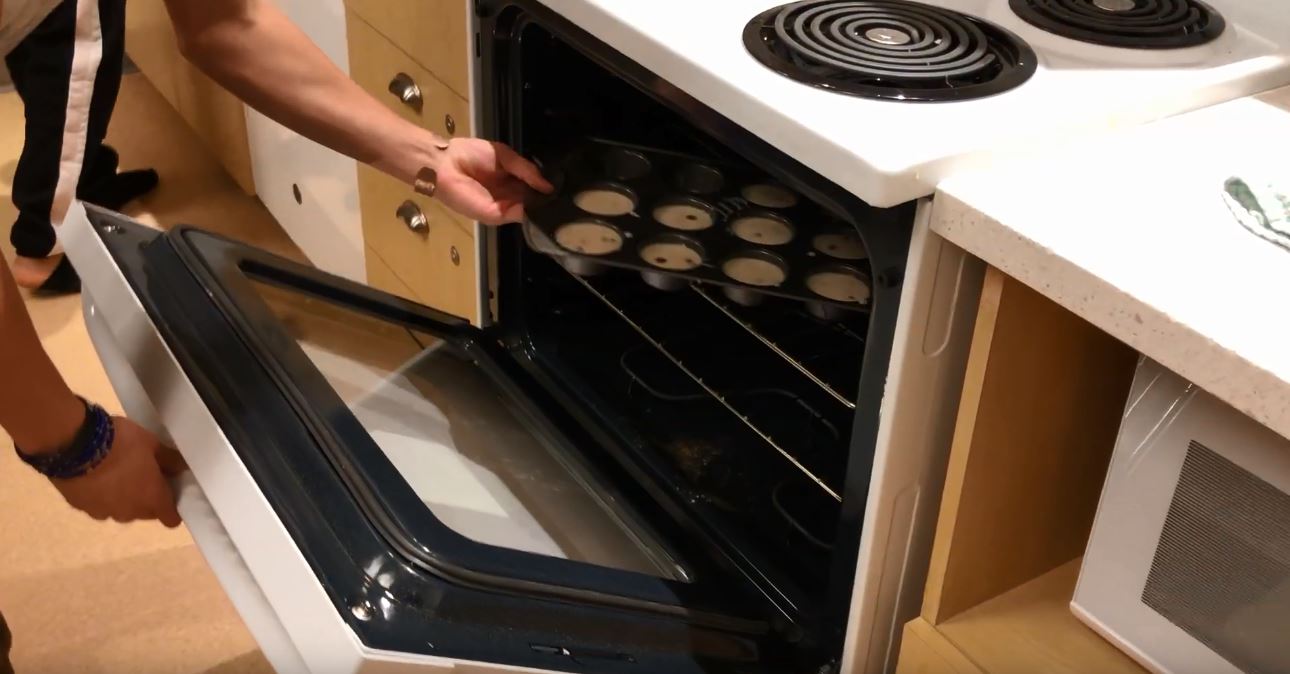 Image of cookies going into oven 