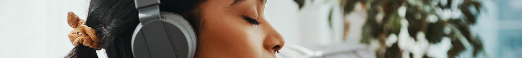Music, mental health and wellbeing for caregivers Woman listening to music