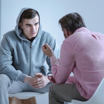 Patient speaking with medical professional