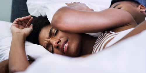 Woman having a restless sleep