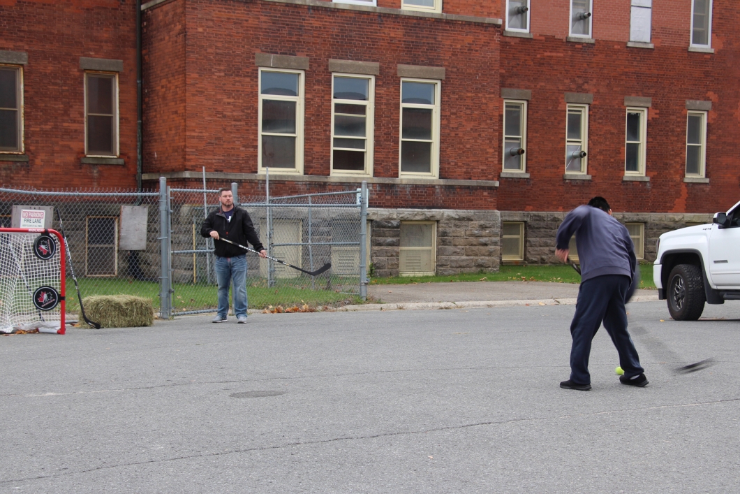 Person playing the hockey slap shot game