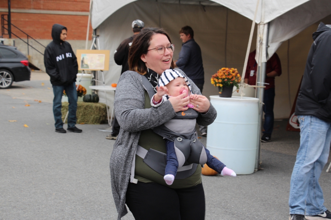 Woman enjoying the celebration with her baby